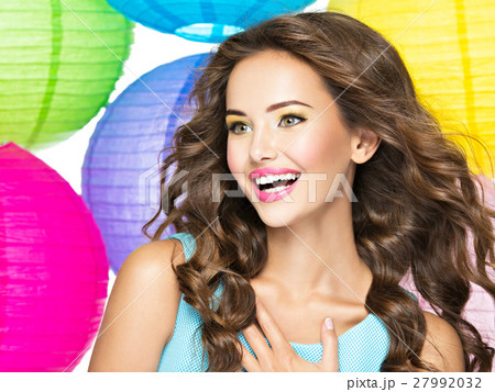 Portrait of happy young girl with long brown hair Portrait of happy young girl with long brown hair 27992032
