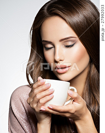 Woman with cup of coffee Woman with cup of coffee 27992033