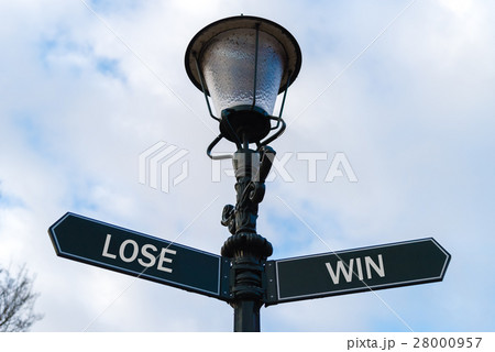 Lose versus Win directional signs on guidepost Lose versus Win directional signs on guidepost 28000957