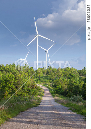 Close up of wind turbines in blue sky 28001085