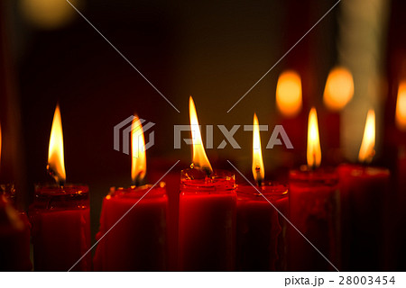 Red Candles Burning Illuminated in the Night Red Candles Burning Illuminated in the Night 28003454