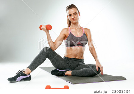 Beautiful slim brunette doing some stretching 28005534