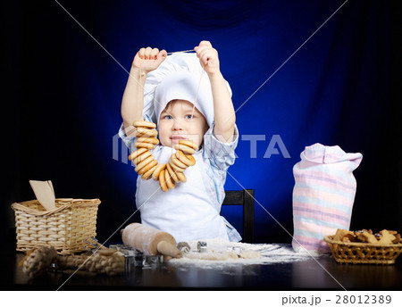 young funny cook with kitchenware young funny cook with kitchenware 28012389