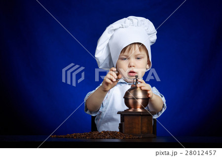 little boy plays with coffee mill little boy plays with coffee mill 28012457