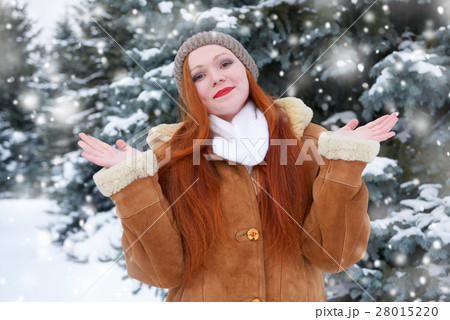 beautiful woman on winter outdoor, snowy fir trees beautiful woman on winter outdoor, snowy fir trees 28015220