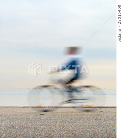 Bicyclist on a quay Bicyclist on a quay 28015409