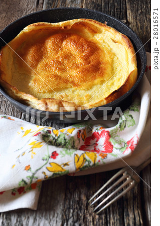 Lush omelet in frying pan Lush omelet in frying pan 28016571