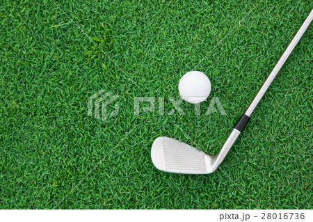 iron golf club and ball on a green grass iron golf club and ball on a green grass 28016736