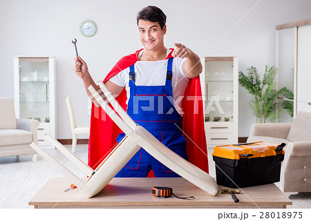 Superhero repairman with tools in repair concept 28018975