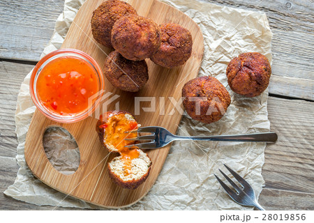 Chicken meatballs with spicy thai sauce Chicken meatballs with spicy thai sauce 28019856