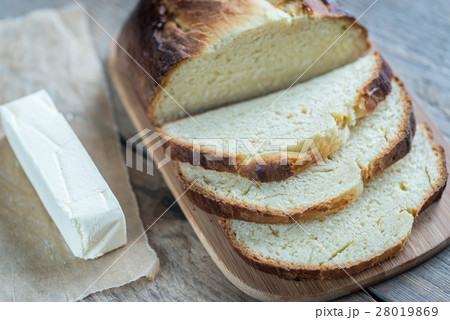 Brioche bread on the wooden board 28019869