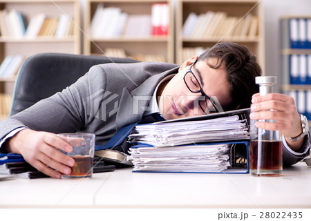 Young businessman drinking from stress 28022435