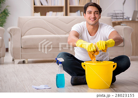 Man husband cleaning the house helping wife Man husband cleaning the house helping wife 28023155