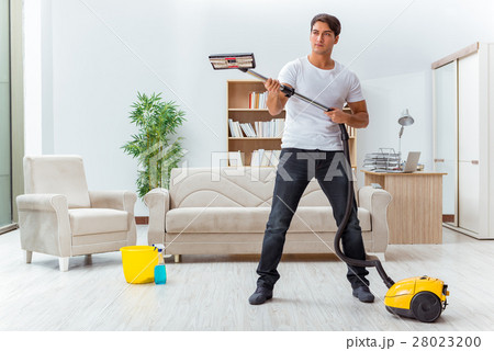 Man husband cleaning the house helping wife 28023200