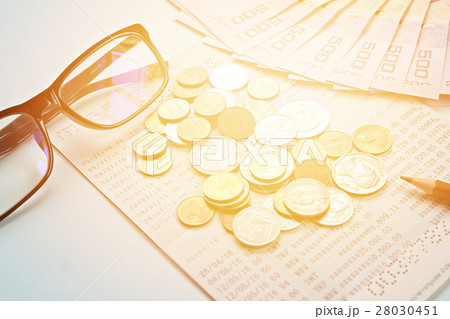 Passbook, money, coins on blue background 28030451