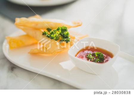 Spring rolls with sweet chili sauce. Modern Asian  28030838
