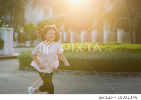 Asian girl  jogging in sunny bright light 28031148