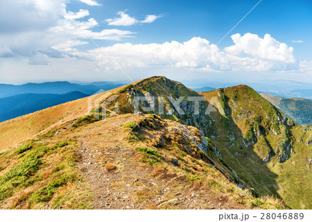 Mountain range with dry yellow grass 28046889