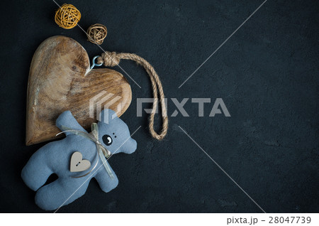 Concrete background with wooden heart 28047739
