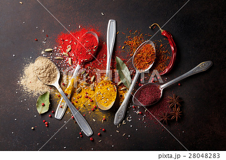 Various spices spoons on stone table Various spices spoons on stone table 28048283