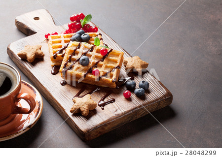 Coffee, sweets and waffles with berries 28048299