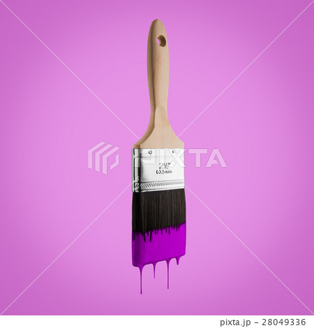 Paintbrush loaded with purple color dripping. 28049336
