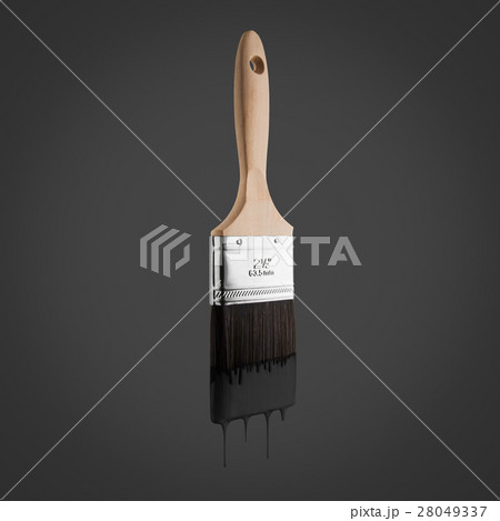Paintbrush loaded with black color dripping. 28049337
