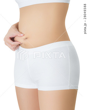 Woman checks and pinching Excess fat in her belly. 28049388