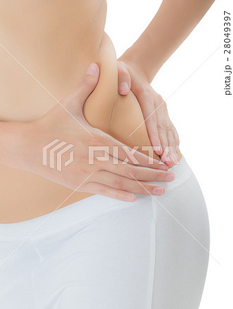 Woman checks and pinching Excess fat on her flank. 28049397