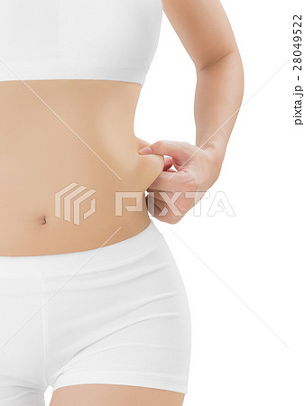 Woman checks and grabbing skin on her flank.の写真素材 [28049522] - PIXTA