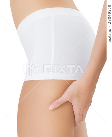 woman squeezing rear thigh showing no cellulite. 28049559