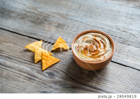 A bowl of hummus with corn chips A bowl of hummus with corn chips 28049819