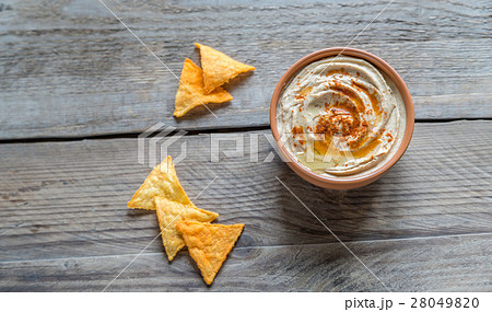 A bowl of hummus with corn chips A bowl of hummus with corn chips 28049820