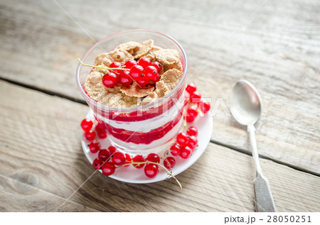 Wholegrain muesli with berry sauce and yogurt Wholegrain muesli with berry sauce and yogurt 28050251