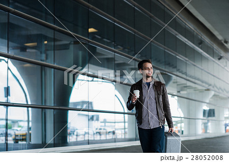 Portrait casual young man leaning against the 28052008