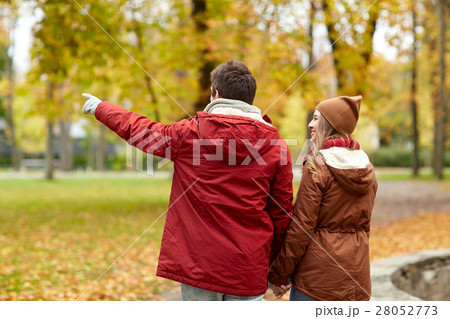 happy young couple walking in autumn park happy young couple walking in autumn park 28052773