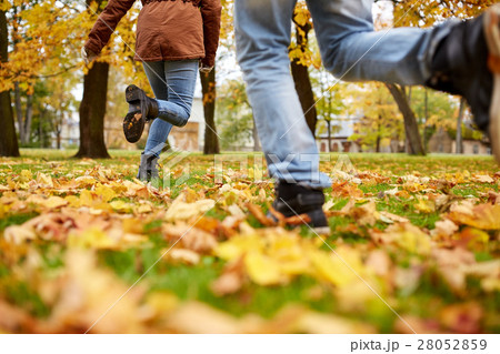 young couple running in autumn park 28052859