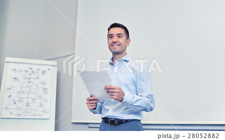 smiling businessman on presentation in office 28052882