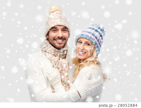 smiling couple in winter clothes hugging 28052884