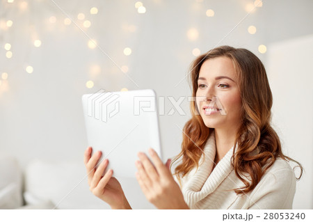 happy young woman with tablet pc at home 28053240