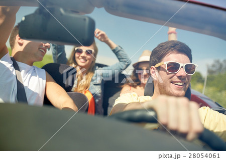 happy friends driving in cabriolet car 28054061
