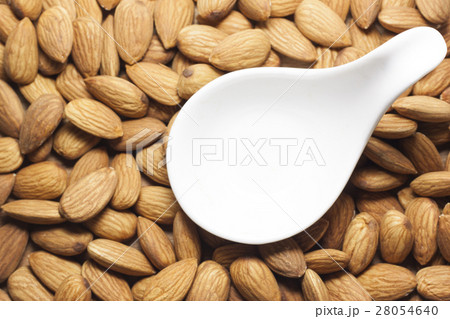 Almonds on a white background. Almonds on a white background. 28054640