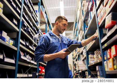 auto mechanic or smith with tablet pc at workshop 28054801