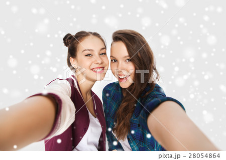 happy smiling pretty teenage girls taking selfie 28054864