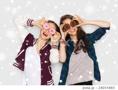 happy pretty teenage girls with donuts having fun 28054865