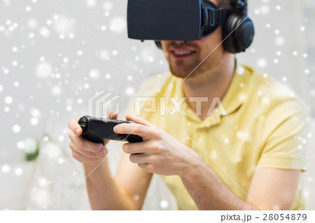 man in virtual reality headset playing man in virtual reality headset playing 28054879