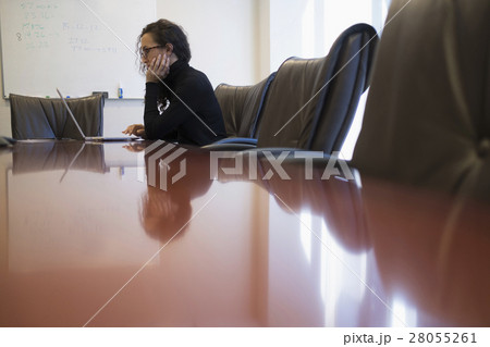 Young business woman sitting in conference room with laptop 28055261