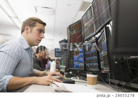 Young traders analyzing computer data 28055278