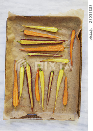 Sliced carrots on baking sheet 28055888