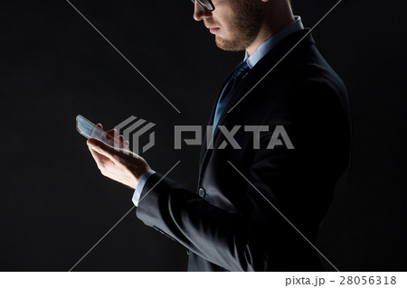 close up of businessman with glass smartphone 28056318